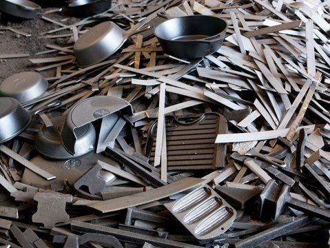 Pile of cut aluminum extrusions and sheet.