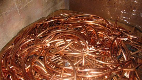 Bin of bright copper wire and tubing.